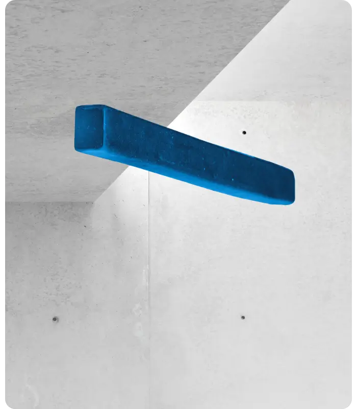 Manorteq HydroBar Original, a blue bentonite waterbar, in front of a concrete wall